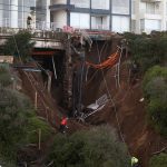 Chilean residents live in fear as homes stand precariously above sinkhole