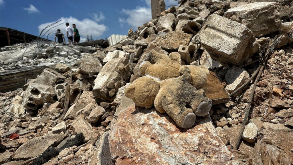 ‘They’ve just killed innocent people’: Anger in Lebanon after Israeli strike – as teddy bears and children’s shoes among rubble