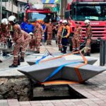 Woman missing after plunging into 8m-deep pavement sinkhole in Malaysia