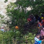 At least 14 killed after bus veers off road and plunges 150 metres down river bank in Nepal