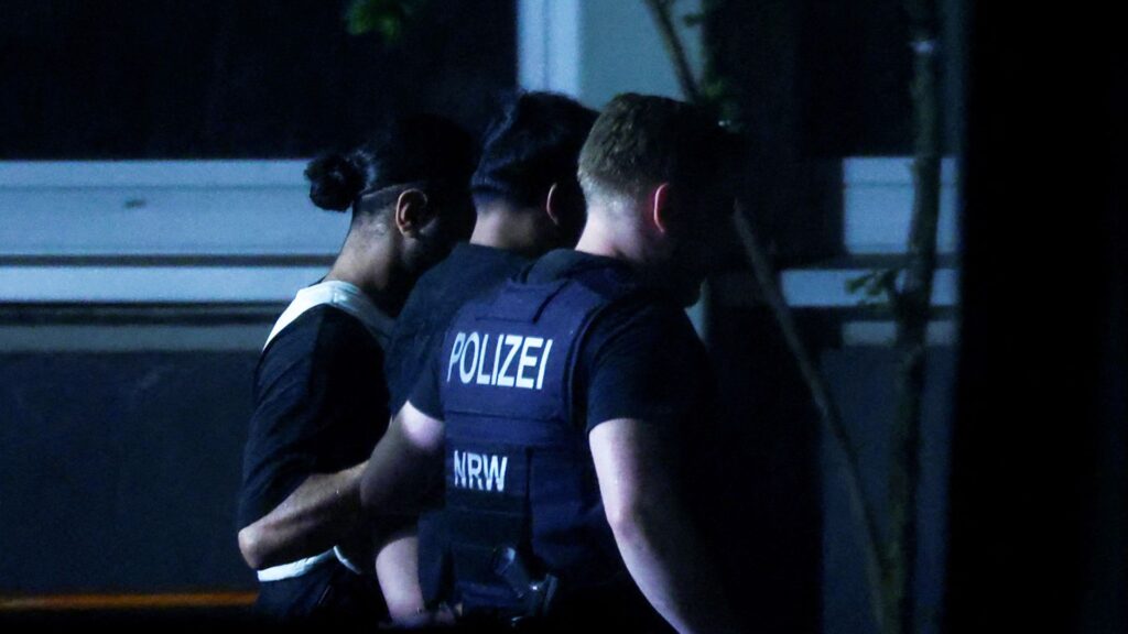 Suspect in deadly knife attack hands himself in to German police as IS claims responsibility