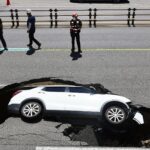 Elderly couple injured in South Korea after sinkhole swallows car