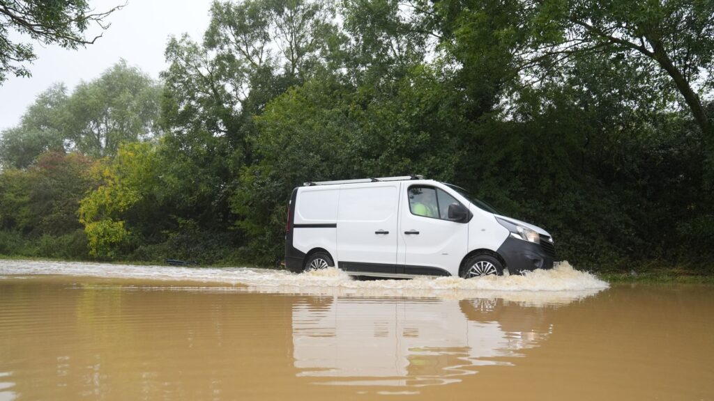 Cars submerged in water as some areas see more than a month’s rainfall