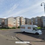 Arrest made after man dies and woman injured at block of flats