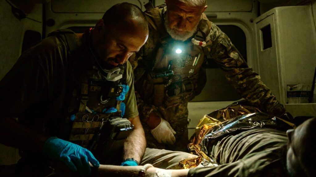 Blacked-out ambulances and bomb-cratered roads: On the night shift with Ukraine medics