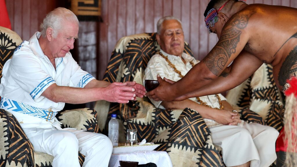 King sips ceremonial drink and is given pig carcass as he’s welcomed to Samoa