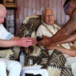 King sips ceremonial drink and is given pig carcass as he’s welcomed to Samoa