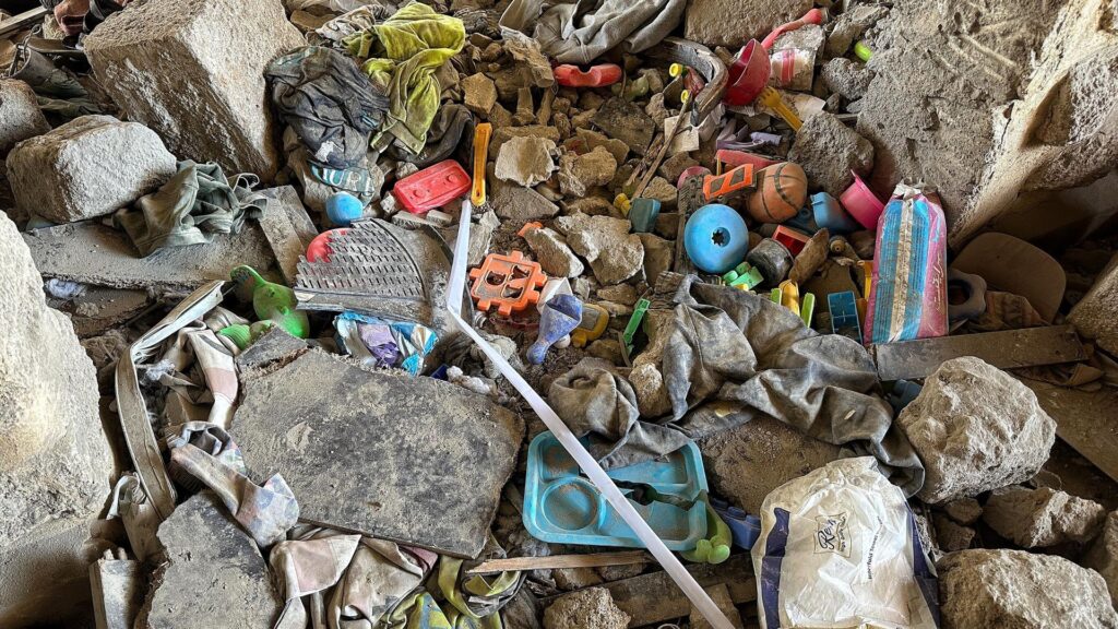 Children’s toys in rubble of deadly apartment block strike