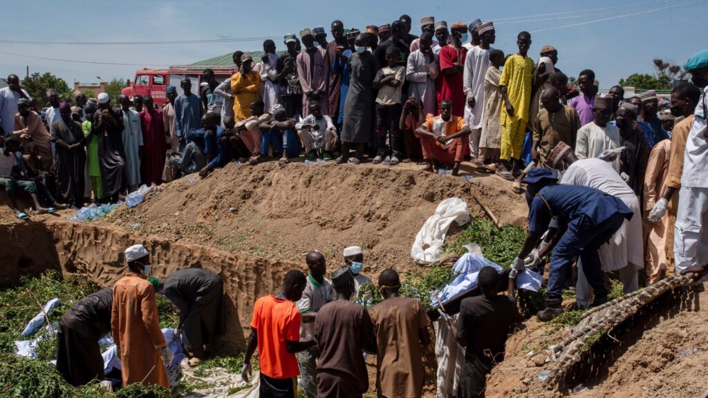 Mass burial after more than 140 killed scavenging fuel from overturned petrol tanker