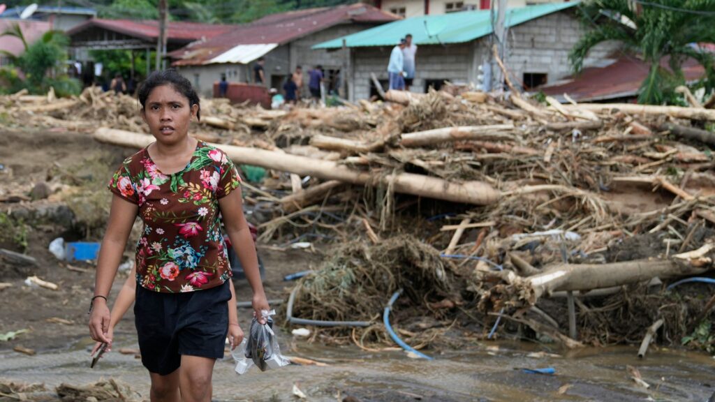 More than 120 killed and dozens injured after tropical storm batters Philippines