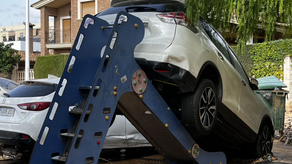 Utterly random damage in Spanish town where 40 died, with a car on top of children’s slide