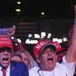 Trump supporters sense a win as they turn off the news for MAGA anthem