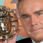 Huw Edwards to keep BAFTA awards – but rules set to change