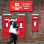 Royal Mail owner warns on prices and jobs due to budget costs