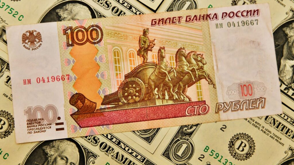 ‘Panic’ in Russia as rouble slips to symbolic mark against US dollar