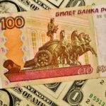 ‘Panic’ in Russia as rouble slips to symbolic mark against US dollar