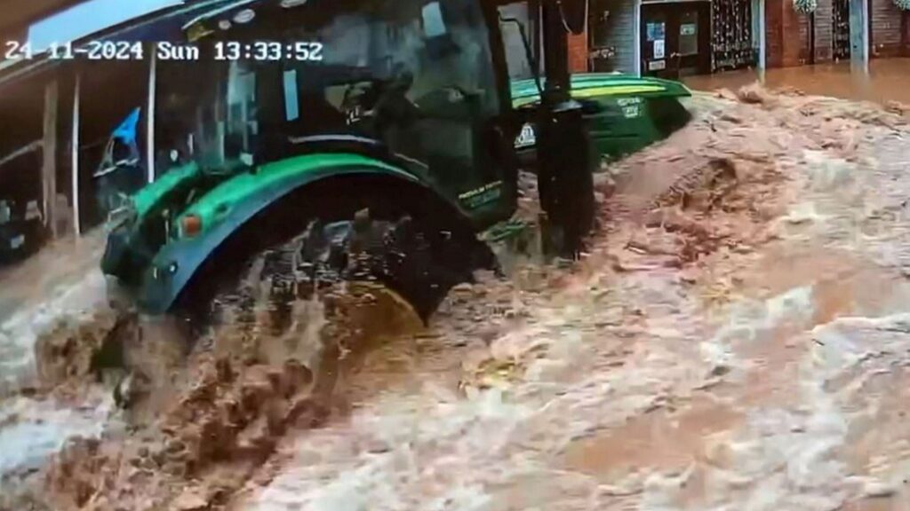 Man arrested after tractor filmed being driven through floodwater during Storm Bert