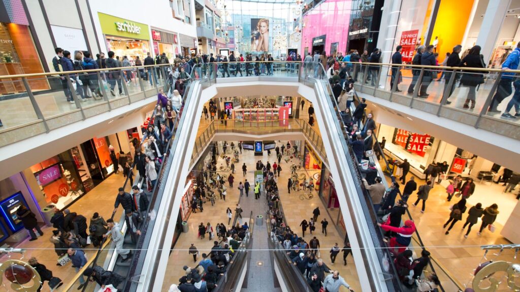 Man falls to his death in busy shopping centre