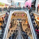 Man falls to his death in busy shopping centre