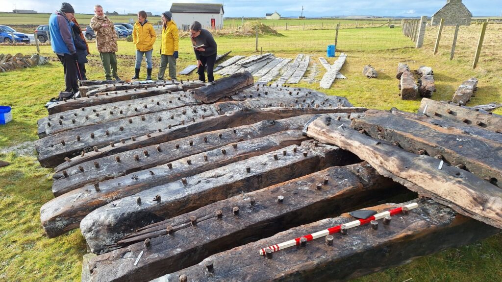 Funding boost to help reveal secrets of beached shipwreck