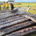 Funding boost to help reveal secrets of beached shipwreck