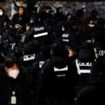 Authorities and security service in standoff – as second attempt to arrest South Korean president under way