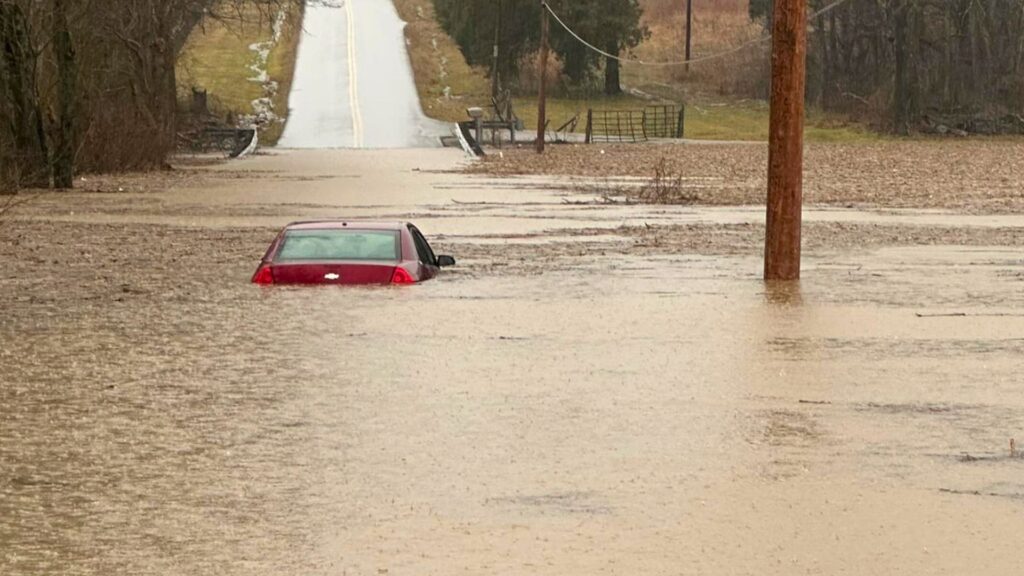 At least 10 dead as severe rain, flooding and lows of -42C hit the US