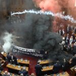 Smoke bombs thrown in Serbia parliament as three MPs injured